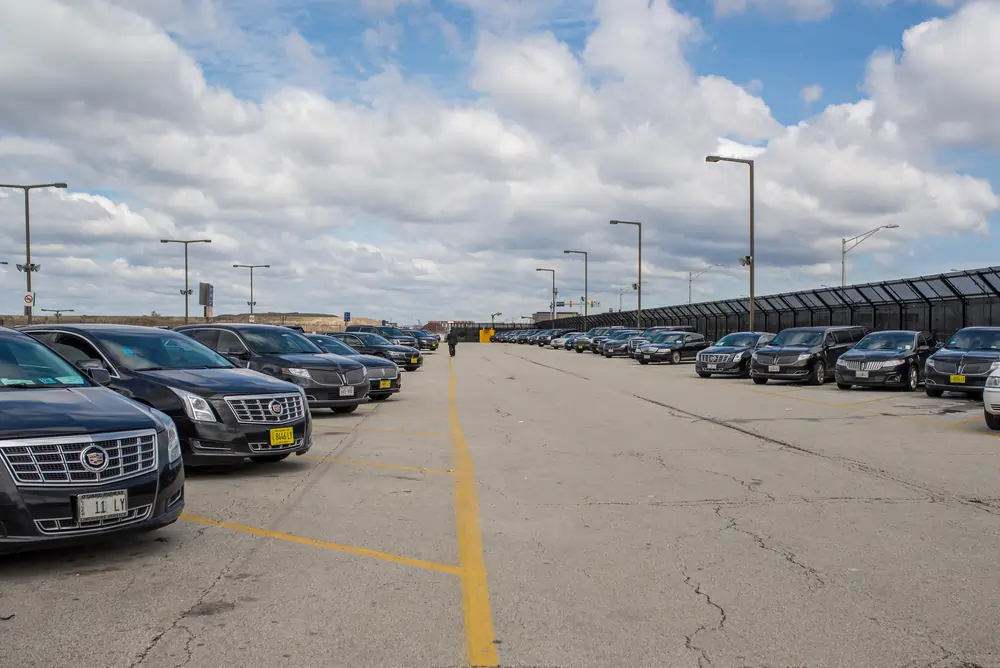 Rows of black luxury cars and SUVs ready for Orangeville Limo Service airport and private rides.